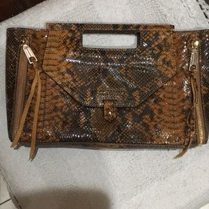 Rebecca Minkoff NWOT leather clutch. Genuine leather has magnetic closure.